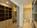 Spacious walk-in closet with ample storage and natural lighting