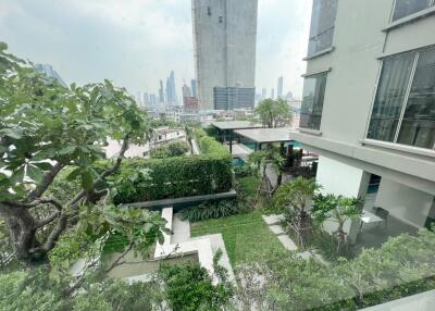 Green garden area overlooking cityscape