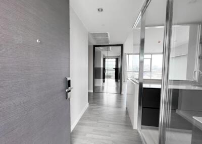 Modern hallway with wooden flooring and a glass partition