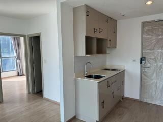 Small kitchen area with sink and cabinets