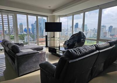 Modern living room with large windows and city view