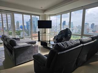 Modern living room with large windows and city view