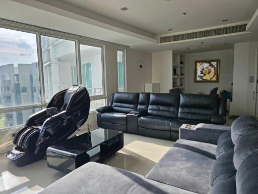 modern living room with large windows and leather furniture