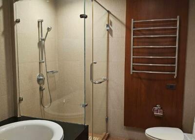 Modern bathroom with glass shower enclosure and bathtub