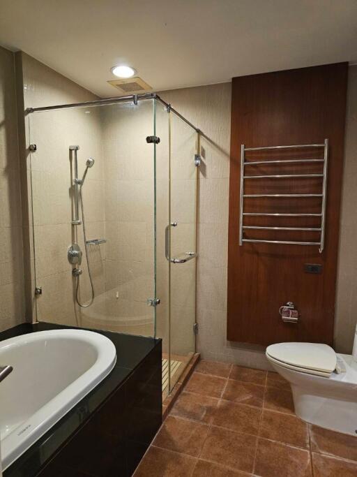 Modern bathroom with glass shower enclosure and bathtub