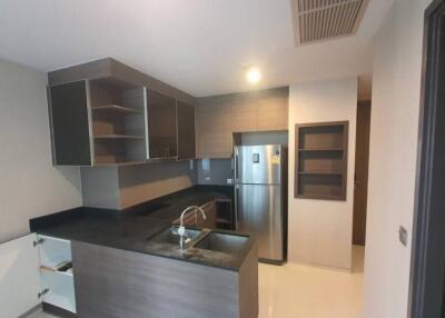 Modern kitchen with stainless steel appliances and dark countertops