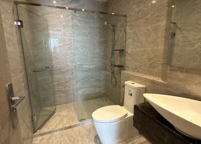 Modern bathroom with glass-enclosed shower