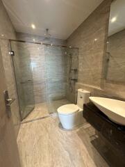 Modern bathroom with glass-enclosed shower