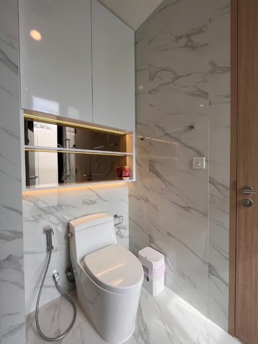 Modern bathroom with fixtures and marble tiles