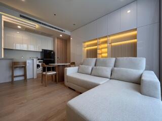 Modern living room with open kitchen and dining area