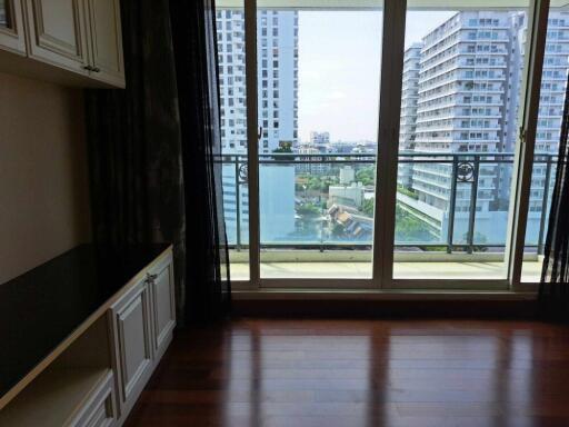 Modern high-rise apartment with city view from the living room