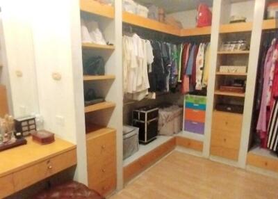 Spacious walk-in closet with ample storage and organization