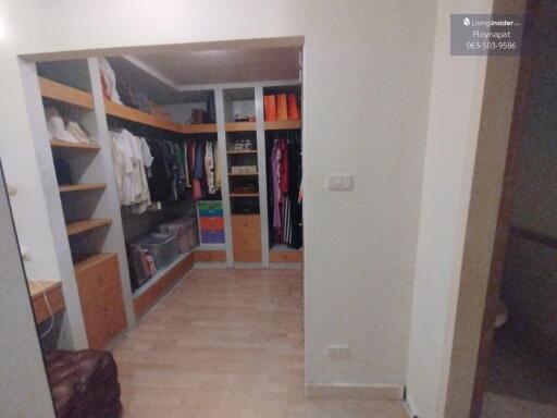 Spacious walk-in closet with ample storage and hanging space