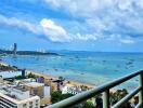 Balcony with a view of the beach and city skyline