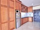 Modern kitchen with wooden cabinetry and stainless steel appliances