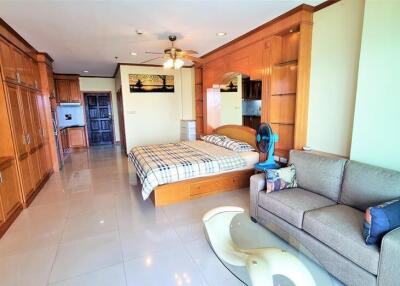 Spacious studio apartment with wooden furnishings and modern amenities