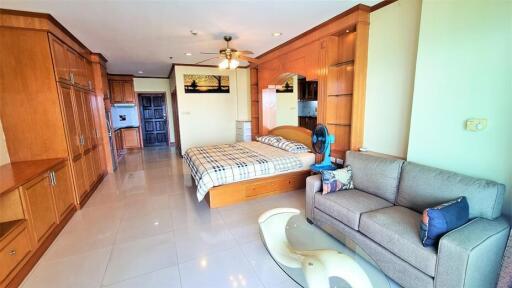 Spacious studio apartment with wooden furnishings and modern amenities