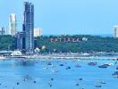 Scenic view of Pattaya city coastline with buildings and boats