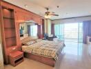 Spacious bedroom with large windows and balcony access