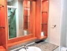 Modern bathroom with wooden accents and large mirror