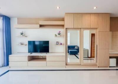 Modern living room with built-in storage and TV