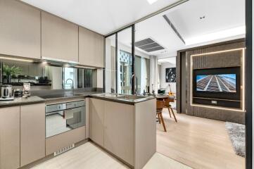 Modern open kitchen and living area with dining space