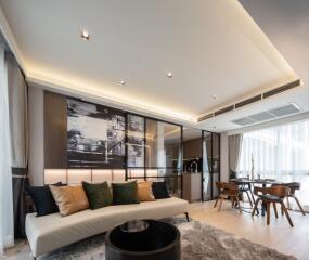 Modern living room with a couch, dining area, and contemporary decor