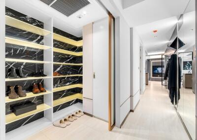 Spacious walk-in closet with wooden shelves and ample storage