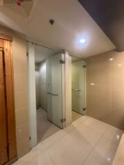 Modern bathroom with shower stalls and glass partitions