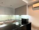 Modern kitchen with appliances and lighting