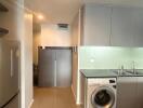 Modern kitchen with integrated laundry area