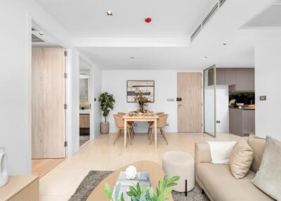 Modern living area with dining table and open kitchen