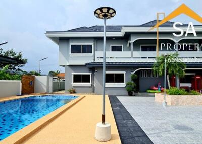 Exterior view of a house with a swimming pool