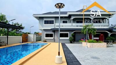 Exterior view of a house with a swimming pool