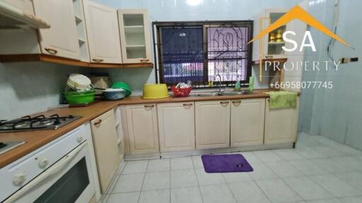 Spacious kitchen with wooden cabinets and modern appliances