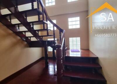 Wooden staircase with glass block windows