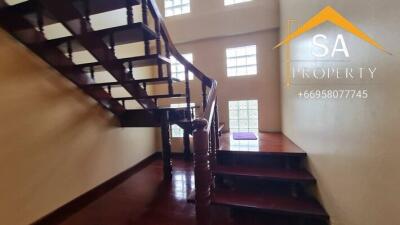 Wooden staircase with glass block windows