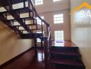 Wooden staircase with glass block windows