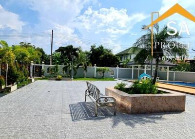 Spacious outdoor courtyard with seating and garden