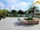 Spacious outdoor courtyard with seating and garden