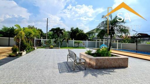 Spacious outdoor courtyard with seating and garden