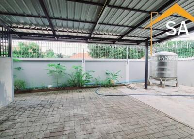 Covered outdoor area with water tank