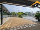 spacious outdoor area with covered parking and manicured landscape