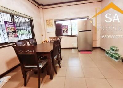 Kitchen with dining table and refrigerator