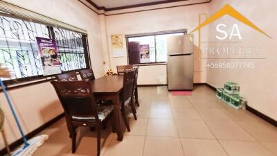 Kitchen with dining table and refrigerator