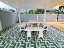 Covered outdoor seating area with tile flooring