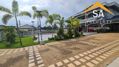 Spacious garden area with modern house exterior