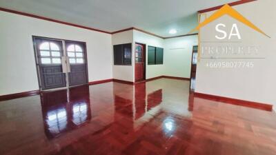 Spacious and bright main living room with wooden flooring