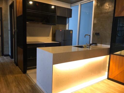 Modern kitchen with island and refrigerator