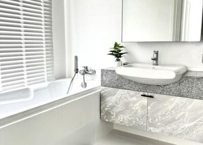 Modern bathroom with tub and sink